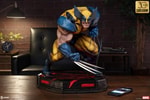 Full view of the Wolverine: Berserker Rage statue displayed on a table in a room, with a phone beside it to highlight its scale and commanding presence. (Prototype Shown) View 2