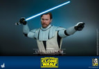 Half-body shot of Obi-Wan Kenobi in white armor, pointing to his left with his right hand holding a lightsaber near his face, wearing a serious expression. (Prototype Shown) View 18