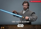 Half-body shot of Obi-Wan Kenobi wielding his blue lightsaber across his face, with his right palm extended outward, displaying a focused expression. (Prototype Shown) View 4