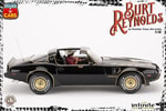 Burt Reynolds on Pontiac Firebird Trans Am 1980