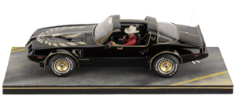 Burt Reynolds on Pontiac Firebird Trans Am 1980