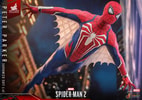 Lower angle shot of Peter Parker in Advanced Suit 2.0, flying through the air with web-wings, set against a city background. (Prototype Shown) View 6