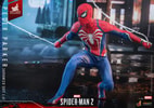 Full shot of Peter Parker in Advanced Suit 2.0, sitting on his left leg, pulling webs back. (Prototype Shown) View 12