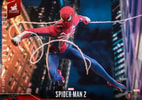 Lower angle view of Peter Parker in Advanced Suit 2.0, soaring through the city while gripping his webs, with his right knee bent. (Prototype Shown) View 13