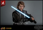 Half-body shot of Anakin Skywalker™ (Artisan Edition) holding blue lightsaber at an angle in both hands. (Prototype Shown) View 15