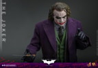 Half-body shot of The Joker (Collector Edition), leaning slightly forward, holding a knife in his right hand, and gesturing with his left hand. (Prototype Shown) View 14