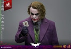 Upper body shot of The Joker (Artisan Edition) wearing a black glove, holding a card in his right hand, with his head slightly down. Collector Edition (Prototype Shown) View 17
