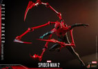 Action shot of Peter Parker (Superior Suit) airborne, right knee bent, left leg extended, with metallic red pincers positioned together in front. (Prototype Shown) View 15