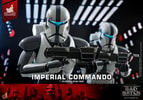 Half-body shot of Imperial Commando™ holding his blaster rifle with both hands, presenting it to the viewer, with another trooper standing behind him. (Prototype Shown) View 15