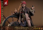 Half body shot of Jack Sparrow leaning against a steering wheel, pointing up with his right hand, holding a compass in his left hand, and grinning. (Prototype Shown) View 12