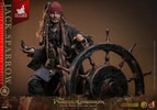 Knee-high shot of Jack Sparrow looking to the left and grinning, holding a compass in his right hand and gripping the steering wheel with his left hand. (Prototype Shown) View 13
