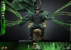 Wide shot of God Loki sitting on a gold throne, wearing his iconic horned helmet and classic attire, with timeline effects and translucent green accents, showcasing a menacing expression. Collector Edition (Prototype Shown) View 3