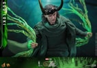 God Loki stepping forward with left foot, wearing classic attire and horned helmet, holding timeline effects in hand. Collector Edition (Prototype Shown) View 15
