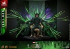 God Loki sitting on a gold throne in iconic horned helmet and attire, with translucent green accents and a menacing expression, set against a green and purple backdrop. (Prototype Shown) View 6