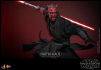 Action shot of Darth Maul (Collector Edition) in the air with his right leg bent, holding a single-bladed lightsaber pulled back with a menacing expression. Collector Edition (Prototype Shown) View 11