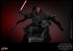 Action shot of Darth Maul (Sith Speeder) (Special Edition) in a crouched position in the air, wearing a black robe, with a menacing expression, holding a single-blade lightsaber in his right hand. (Prototype Shown) View 5