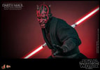 Half body shot of Darth Maul (Sith Speeder) (Special Edition) showing him in a slight crouch with his left palm extended in front, holding a dual lightsaber pulled back by his right side, with a menacing expression. (Prototype Shown) View 15