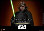 Half-body shot of Luke Skywalker™ (Dark Empire) holding a lightsaber with both hands to the right side of his body, sporting a serious expression. (Prototype Shown) View 11