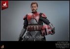 Half-body shot of Obi-Wan Kenobi™ in a wide stance, holding a blaster pistol in his left hand and a newly painted helmet with distressed effects in his right hand. (Prototype Shown) View 16