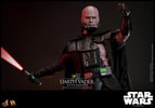 Half body shot of Darth Vader™ (Battle Damaged) unmasked, holding up a lightsaber in his right hand, and extending his mechno left arm. Collector Edition (Prototype Shown) View 15