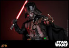 Left angle view of Darth Vader™ (Battle Damaged) in full suit, holding up lightsaber in his right hand and extending his mechno left arm. (Prototype Shown) View 20