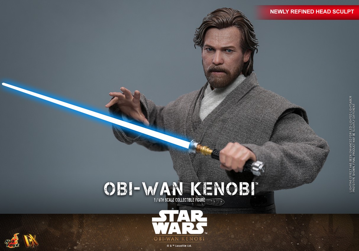 Half-body shot of Obi-Wan Kenobi wielding his blue lightsaber across his face, with his right palm extended outward, displaying a focused expression.- Prototype Shown View 4