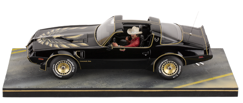 Burt Reynolds on Pontiac Firebird Trans Am 1980
