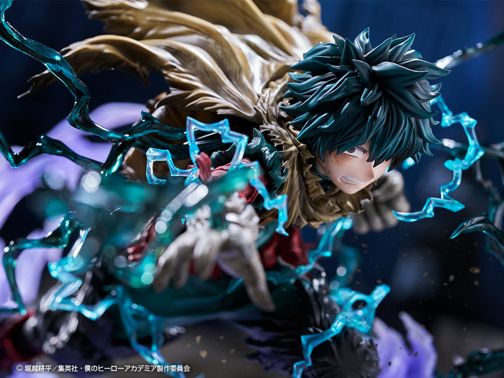Close up of Izuku Midoriya on a display base, showing his iconic expression, set against an industrial background. (Prototype Shown) View 18