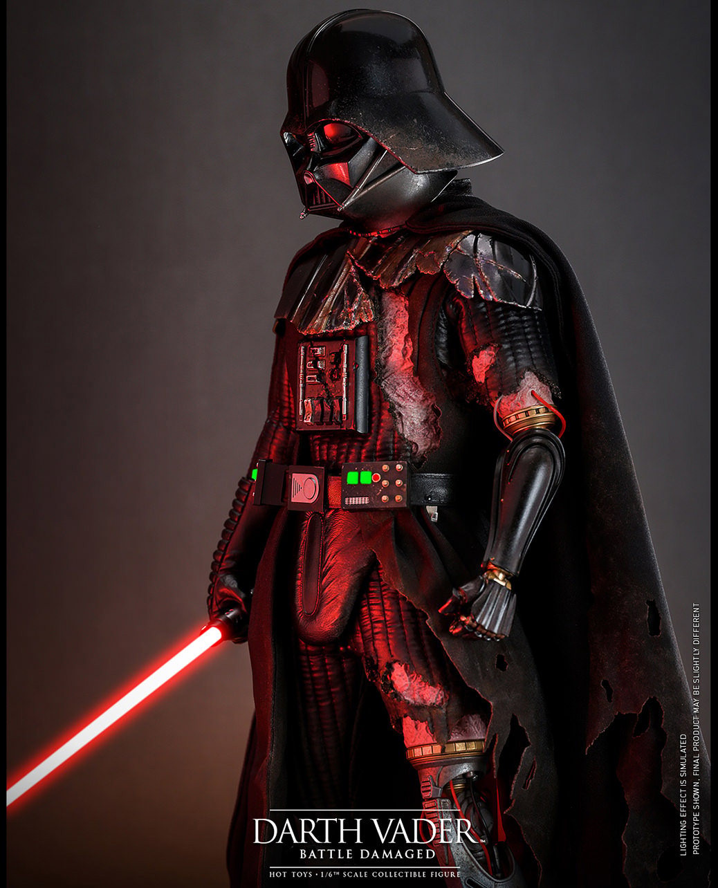 Left side view of Darth Vader™ (Battle Damaged) in full suit, holding a lightsaber in his right hand with his mechno left arm at his side. (Prototype Shown) View 5