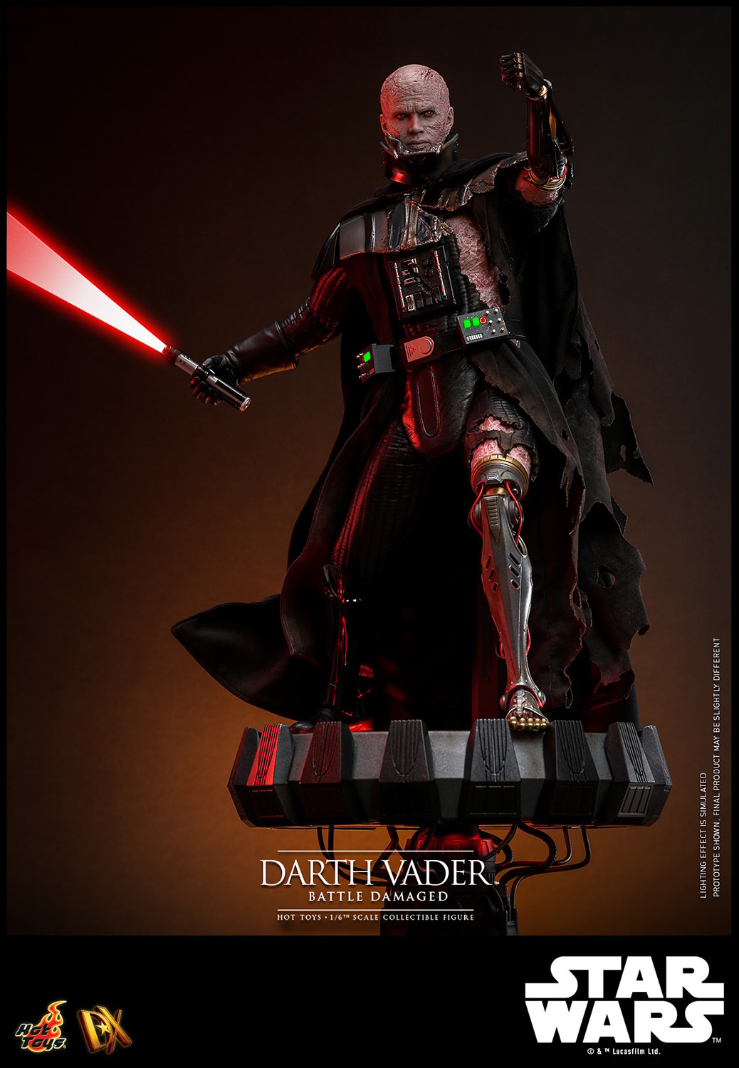 Lower left angle shot of Darth Vader™ (Battle Damaged) unmasked, displayed on a base, holding a lightsaber in his right hand, and extending his mechno left arm. (Prototype Shown) View 16
