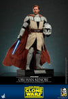 Full-body shot of Obi-Wan Kenobi standing with his right side forward, holding a blue lightsaber in his right hand and his helmet in his left, posed on a display base. (Prototype Shown) View 7