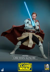 Full-body shot of Obi-Wan Kenobi in a wide stance, gripping his lightsaber in front of him, draped in his brown cape with a focused, serious expression. (Prototype Shown) View 9