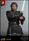 Knee-high shot of Anakin Skywalker™ (Artisan Edition) holding blue lightsaber in both hands to the left of his torso, wearing black glove on right hand. (Prototype Shown) View 1