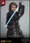 Half-body close-up of Anakin Skywalker™ (Artisan Edition) holding blue lightsaber upside down with both hands near his face, black glove on right hand. (Prototype Shown) View 12