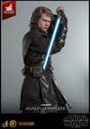 Half-body shot of Anakin Skywalker™ (Artisan Edition) with back turned, holding blue lightsaber upside down near his face, wearing black glove on right hand. (Prototype Shown) View 13
