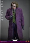 Knee-high shot of The Joker (Collector Edition) holding a knife up with his right hand, left hand down to his side, head slightly down, and eyes looking up, exuding a menacing presence. (Prototype Shown) View 4