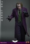 Knee-high shot of The Joker (Collector Edition) with his right hand slightly raised holding a knife and his left arm bent, slightly pointing forward. (Prototype Shown) View 11
