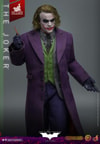 Knee-high shot of The Joker (Artisan Edition) wearing black gloves, holding a pencil up with his right hand, and left arm slightly extended outward. Collector Edition (Prototype Shown) View 5