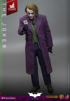 Full body shot of The Joker (Artisan Edition) holding a card up with his right hand and a knife in his left hand, with his left arm down by his side. Collector Edition (Prototype Shown) View 9