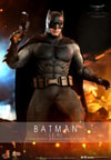 Half-body shot of Batman (2.0) in full suit, gripping a pistol in his right hand, showcasing the detailed armor and weapon design. Collector Edition (Prototype Shown) View 1