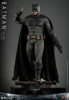 Full-body shot of Batman (2.0) on a display base, in full suit with left leg forward, holding a batarang in his right hand and a rifle in his left. Collector Edition (Prototype Shown) View 4