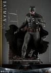 Full action shot of Batman (2.0) in alleyway diorama, leading with his right leg, holding a batarang with his right hand and a pistol with his left. (Prototype Shown) View 6