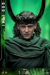 Close-up shot of God Loki in his classic attire and iconic horned helmet, showcasing a menacing expression against a light green background. Collector Edition (Prototype Shown) View 5