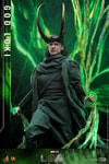 God Loki at a lower angle stepping forward with right foot, wearing classic attire and horned helmet, holding timeline effects in hand. Collector Edition (Prototype Shown) View 11