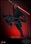 Action shot of Darth Maul (Collector Edition) in the air with his right leg bent, holding a single-bladed lightsaber pulled back with a menacing expression. Collector Edition (Prototype Shown) View 7