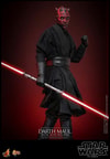 Full body shot of Darth Maul (Sith Speeder) holding a dual-bladed lightsaber in his right hand, with his left arm curled up and upper body turned toward the front. Collector Edition (Prototype Shown) View 6