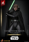 Full-body shot of Luke Skywalker™ (Dark Empire) with a serious expression, holding his green lightsaber on the right side of his face with both hands, slightly crouched. (Prototype Shown) View 6