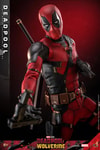 Close-up half body shot of Deadpool Sixth Scale Action Figure by Hot Toys, with swords on his back, one gun in left hand, and flipping another gun in his right hand. Collector Edition (Prototype Shown) View 5