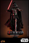 Left angle view of Darth Vader™ (Battle Damaged) in full suit, standing on a display base, holding up lightsaber in his right hand and extending his mechno left arm. Collector Edition (Prototype Shown) View 10