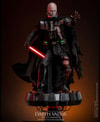Wide shot of Darth Vader™ (Battle Damaged) unmasked, standing on a display base, holding a lightsaber in his right hand, and extending his mechno left arm. (Prototype Shown) View 4